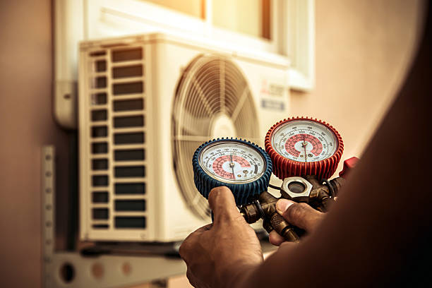 Professional Air Conditioning Service technician working in Summerfield, FL